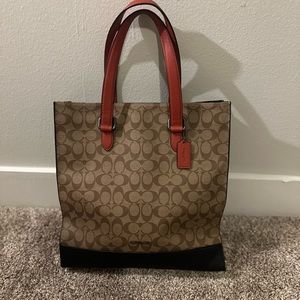 Coach brown bag with black bottom and orange handle